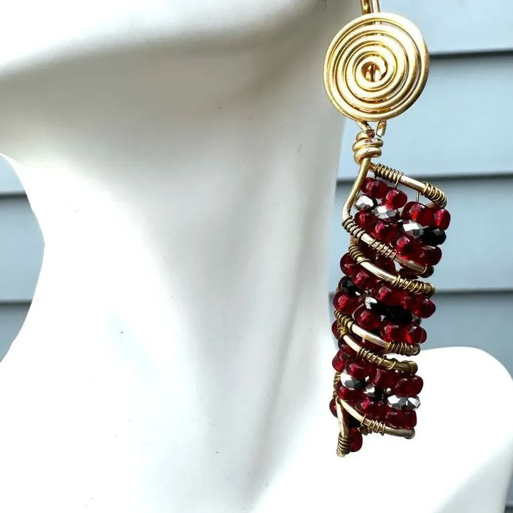 Red beaded gold tone drop earrings